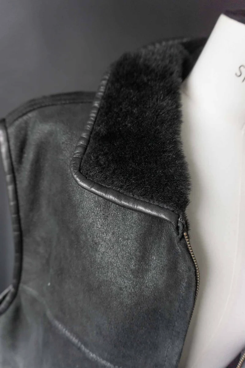 Vintage Echtlederweste mit Lammfellfutter, S–M